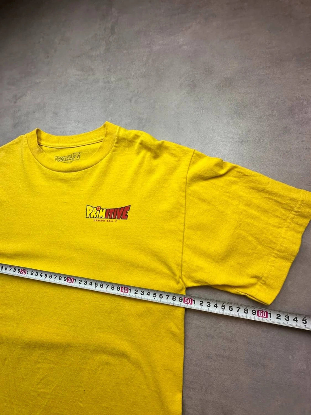 T-Shirt Dragon Ball Z Primitive Goku Graphic Jaune – Y2K