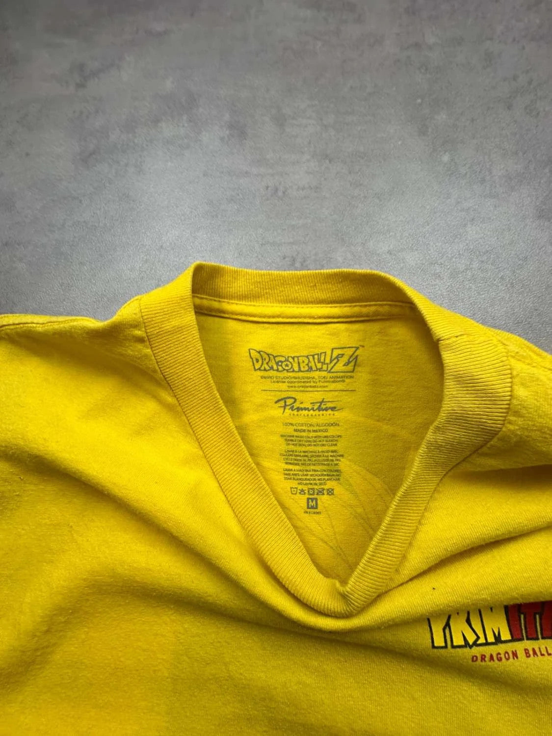 T-Shirt Dragon Ball Z Primitive Goku Graphic Jaune – Y2K